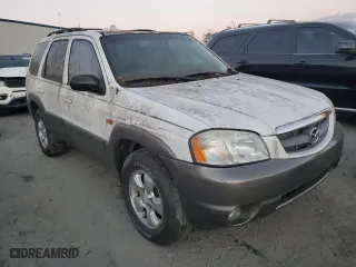2003 Mazda Tribute LX with VIN 4F2YZ94133KM20084, listed as a Copart auction lot 82598104 with 216,848 mi miles and Salvage Title. Bid and sale history available at carsss.com. Image 4.