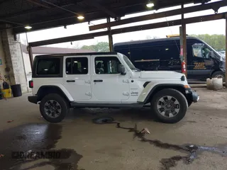 2018 Jeep Wrangler Unlimited Sahara with VIN 1C4HJXEG3JW116404, listed as a IAAI auction lot 42152506 with 57,727 mi miles and . Bid and sale history available at DreamBid. Image 13.