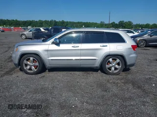 2011 Jeep Grand Cherokee Overland Summit with VIN 1J4RR6GT9BC535985, listed as a IAAI auction lot 42556913 with 108,845 mi miles and . Bid and sale history available at DreamBid. Image 14.