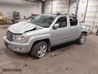 2014 Honda Ridgeline RTL with VIN 5FPYK1F57EB012362, listed as a IAAI auction lot 41078509 with 149,590 mi miles. Bid and sale history available at carsss.com. Image 2.