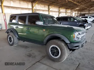 2023 Ford Bronco with VIN 1FMEE5DP9PLB29838, listed as a Copart auction lot 62409785 with 11,124 mi miles and Salvage title. Bid and sale history available at DreamBid. Image 4.