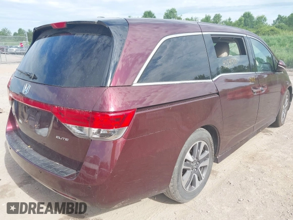 2014 Honda Odyssey Touring with VIN 5FNRL5H90EB120999, listed as a IAAI auction lot 42541370 with 96,454 mi miles and . Bid and sale history available at DreamBid. Image 4.