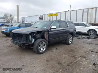 2015 Chevrolet Tahoe LTZ with VIN 1GNSKCKC2FR107428, listed as a IAAI auction lot 41911940 with 148,668 mi miles. Bid and sale history available at carsss.com. Image 2.