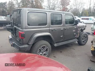2021 Jeep Wrangler Unlimited Sahara z VIN 1C4JJXP68MW745098, wystawiony jako IAAI lot #41461092 z przebiegiem 36 410 mil mil oraz . Historia ofert i sprzedaży dostępna na DreamBid. Obrazek 4.