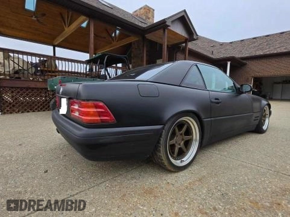 1999 Mercedes-Benz SL 500 with VIN WDBFA68FXXF184548, listed as a Copart auction lot 48104955 with 133,450 mi miles and Clean title. Bid and sale history available at DreamBid. Image 4.