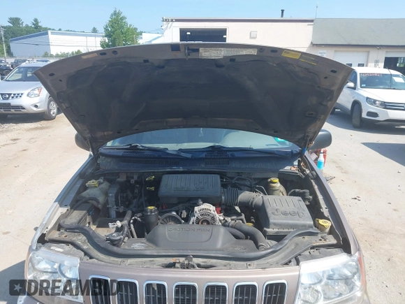 2002 Jeep Grand Cherokee Limited z VIN 1J8GW58N62C213751, wystawiony jako IAAI lot #42478869 z przebiegiem 233 848 mil mil oraz . Historia ofert i sprzedaży dostępna na DreamBid. Obrazek 10.