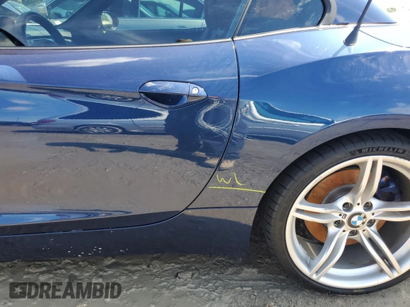 2011 BMW Z4 sDrive35is with VIN WBALM1C56BE393858, listed as a Copart auction lot 74249954 with Not provided miles and Salvage title. Bid and sale history available at DreamBid. Image 12.