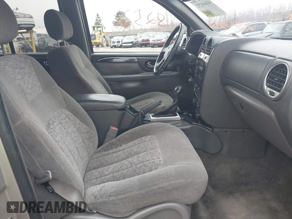 2004 GMC Envoy SLE with VIN 1GKDT13SX42135951, listed as a IAAI auction lot 41668252 with 216,193 mi miles. Bid and sale history available at carsss.com. Image 5.