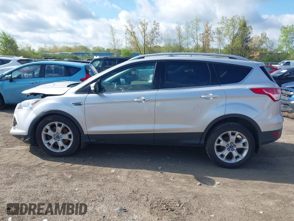 2015 Ford Escape Titanium z VIN 1FMCU9J99FUC75852, wystawiony jako IAAI lot #42171467 z przebiegiem 113 322 mil mil oraz . Historia ofert i sprzedaży dostępna na DreamBid. Obrazek 14.