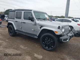 2021 Jeep Wrangler Unlimited Sahara with VIN 1C4JJXP66MW703111, listed as a IAAI auction lot 41037077 with 41,479 mi miles and . Bid and sale history available at DreamBid. Image 1.