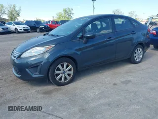 2011 Ford Fiesta SE z VIN 3FADP4BJ5BM219052, wystawiony jako IAAI lot #42297403 z przebiegiem 108 302 mil mil oraz . Historia ofert i sprzedaży dostępna na DreamBid. Obrazek 2.