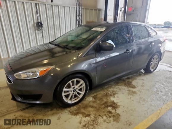 2018 Ford Focus SE with VIN 1FADP3FE0JL311760, listed as a Copart auction lot 63621755 with 81,000 mi miles and Salvage title. Bid and sale history available at DreamBid. Image 1.
