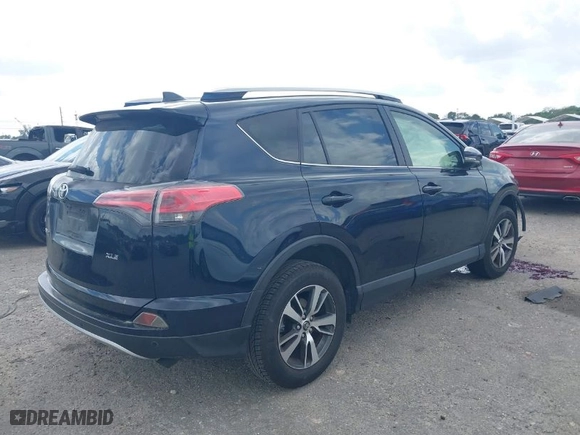 2018 Toyota RAV4 XLE with VIN JTMWFREV8JJ172645, listed as a IAAI auction lot 41734624 with 105,674 mi miles. Bid and sale history available at carsss.com. Image 2.