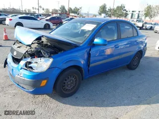 2009 Kia Rio with VIN KNADE223296502151, listed as a IAAI auction lot 41602918 with 143,996 mi miles. Bid and sale history available at carsss.com. Image 2.