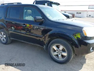 2009 Honda Pilot EX-L with VIN 5FNYF48529B035128, listed as a IAAI auction lot 42006450 with 214,069 mi miles. Bid and sale history available at carsss.com. Image 1.