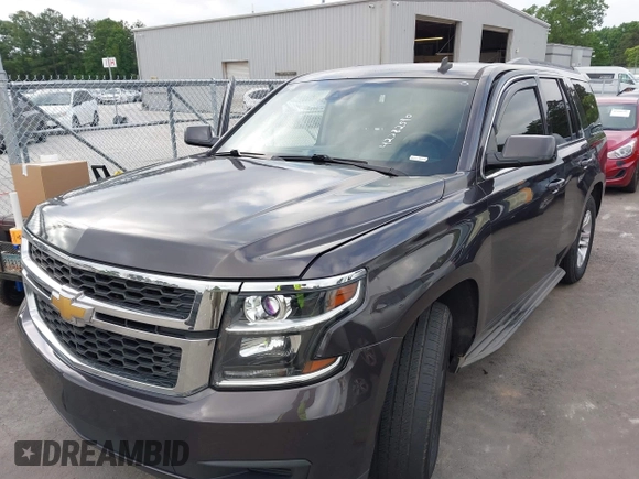 2015 Chevrolet Tahoe LS with VIN 1GNSCAKC0FR245826, listed as a IAAI auction lot 42282590 with 164,208 mi miles and . Bid and sale history available at DreamBid. Image 2.
