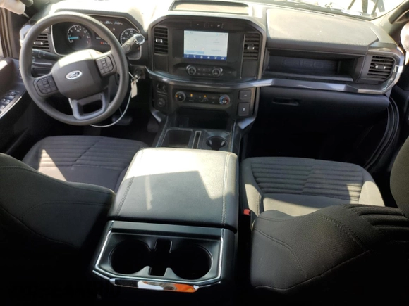 2023 Ford F-150 XL with VIN 1FTEW1CP4PKD21685, listed as a Copart auction lot 54992615 with 27,252 mi miles and Salvage title. Bid and sale history available at DreamBid. Image 8.