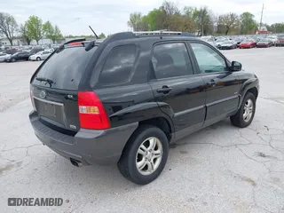 2007 Kia Sportage LX with VIN KNDJE723077397667, listed as a IAAI auction lot 42011122 with 218,744 mi miles. Bid and sale history available at carsss.com. Image 4.