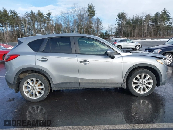 2014 Mazda CX-5 Grand Touring with VIN JM3KE2DY8E0304911, listed as a IAAI auction lot 41672197 with 77,523 mi miles. Bid and sale history available at carsss.com. Image 13.
