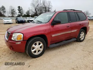 2004 GMC Envoy SLT with VIN 1GKDT13S342262833, listed as a Copart auction lot 87828975 with 203,404 mi miles and Salvage Title. Bid and sale history available at carsss.com. Image 1.