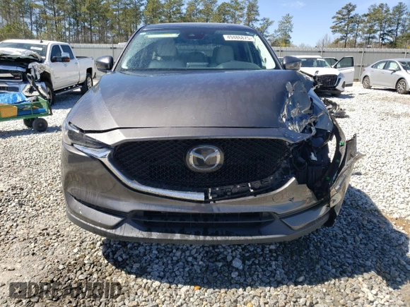 2018 Mazda CX-5 Grand Touring with VIN JM3KFADM2J1313418, listed as a Copart auction lot 49486875 with 94,930 mi miles and Salvage Title. Bid and sale history available at carsss.com. Image 5.