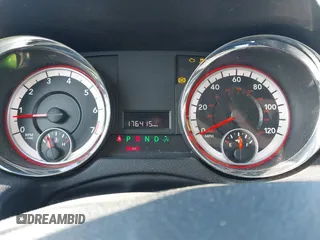 2014 Dodge Grand Caravan American Value with VIN 2C4RDGBG7ER422178, listed as a IAAI auction lot 41352312 with 176,415 mi miles and . Bid and sale history available at DreamBid. Image 7.