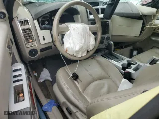 2010 Mercury Mariner Premier with VIN 4M2CN9HG9AKJ11618, listed as a Copart auction lot 64949334 with 0 mi miles and Salvage Title. Bid and sale history available at carsss.com. Image 8.