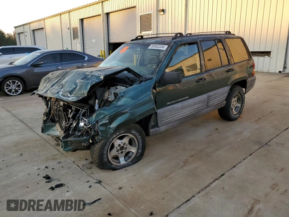 1997 Jeep Grand Cherokee TSi with VIN 1J4FX58SXVC565347, listed as a Copart auction lot 80953334 with 355,373 mi miles and Salvage Title. Bid and sale history available at carsss.com. Image 1.