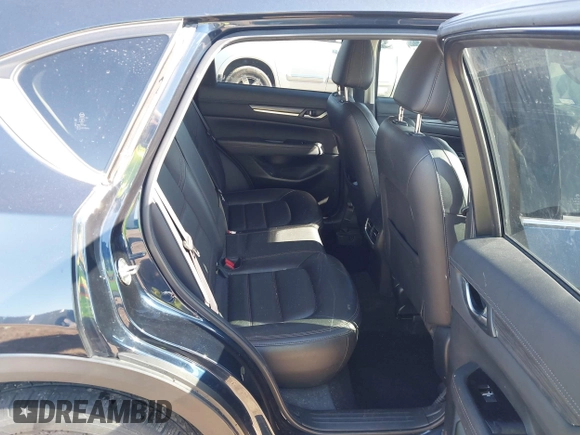 2019 Mazda CX-5 Grand Touring with VIN JM3KFBDM2K1685168, listed as a IAAI auction lot 41323598 with 88,429 mi miles. Bid and sale history available at carsss.com. Image 8.
