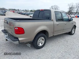 2001 Ford F-150 XLT with VIN 1FTRW07W01KB64001, listed as a IAAI auction lot 41903682 with 175,396 mi miles and . Bid and sale history available at DreamBid. Image 4.