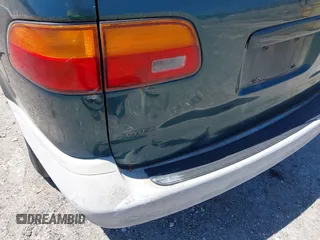 1998 Toyota Sienna LE with VIN 4T3ZF13C0WU038446, listed as a IAAI auction lot 42038331 with 228,832 mi miles. Bid and sale history available at carsss.com. Image 6.
