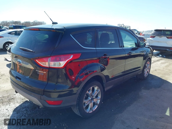 2013 Ford Escape SEL with VIN 1FMCU0HX4DUB31123, listed as a IAAI auction lot 41740392 with 171,239 mi miles. Bid and sale history available at carsss.com. Image 4.