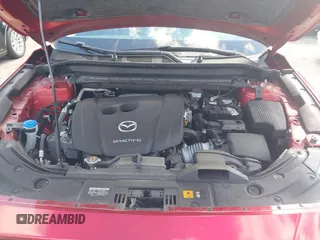 2020 Mazda CX-5 Sport with VIN JM3KFABM7L1819493, listed as a IAAI auction lot 41304240 with 52,940 mi miles. Bid and sale history available at carsss.com. Image 10.