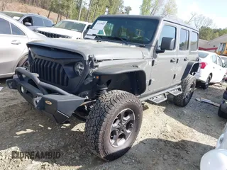 2019 Jeep Wrangler Unlimited Sport Altitude with VIN 1C4HJXDG3KW639148, listed as a IAAI auction lot 41933844 with 57,184 mi miles and . Bid and sale history available at DreamBid. Image 2.