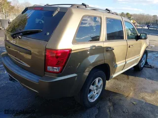 2009 Jeep Grand Cherokee Laredo with VIN 1J8GS48K79C516320, listed as a IAAI auction lot 41353131 with 166,739 mi miles. Bid and sale history available at carsss.com. Image 4.