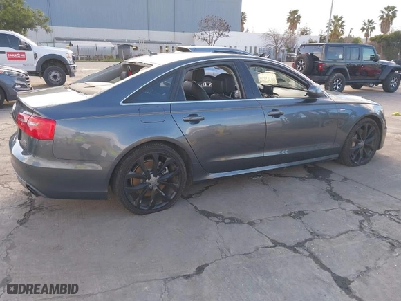 2014 Audi A6 3.0T Prestige with VIN WAUHGAFC7EN036961, listed as a IAAI auction lot 41741972 with 113,642 mi miles. Bid and sale history available at carsss.com. Image 4.