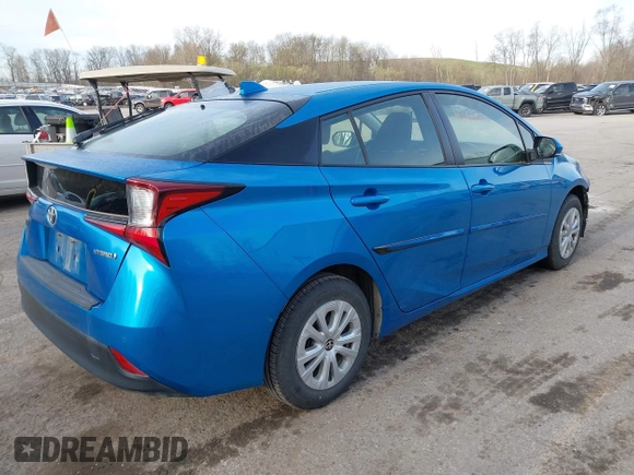 2021 Toyota Prius L Eco with VIN JTDKAMFU5M3145949, listed as a IAAI auction lot 42113123 with 127,872 mi miles and . Bid and sale history available at DreamBid. Image 4.