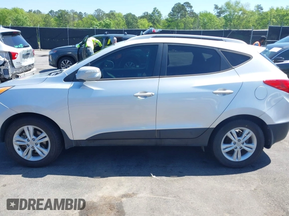 2013 Hyundai Tucson GLS with VIN KM8JU3AC3DU551018, listed as a IAAI auction lot 41988305 with 214,728 mi miles. Bid and sale history available at carsss.com. Image 14.