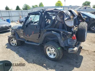 2002 Jeep Wrangler Sport with VIN 1J4FA49S02P721457, listed as a Copart auction lot 61726855 with 76,191 mi miles and Salvage title. Bid and sale history available at DreamBid. Image 2.