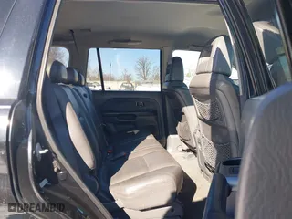 2004 Honda Pilot EX with VIN 2HKYF18544H574133, listed as a IAAI auction lot 41415703 with 217,539 mi miles. Bid and sale history available at carsss.com. Image 8.