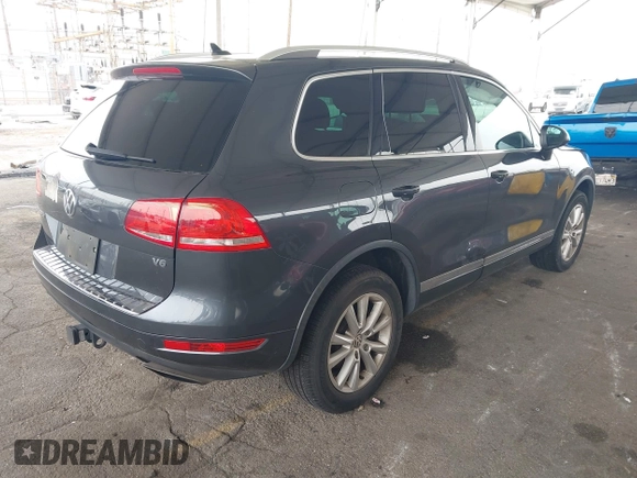 2014 Volkswagen Touareg Sport with VIN WVGEF9BP0ED015273, listed as a IAAI auction lot 42046823 with 84,694 mi miles and . Bid and sale history available at DreamBid. Image 4.