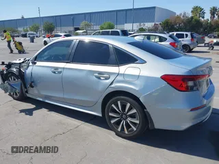2022 Honda Civic Sedan EX with VIN 2HGFE1F77NH309152, listed as a IAAI auction lot 42013565 with 25,474 mi miles. Bid and sale history available at carsss.com. Image 3.