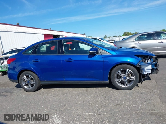 2018 Ford Focus SE z VIN 1FADP3FE4JL279265, wystawiony jako IAAI lot #42068130 z przebiegiem 43 616 mil mil oraz . Historia ofert i sprzedaży dostępna na DreamBid. Obrazek 14.