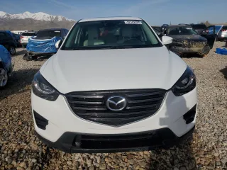 2016 Mazda CX-5 Grand Touring with VIN JM3KE4DY3G0688286, listed as a Copart auction lot 52182205 with 194,352 mi miles and Salvage Title. Bid and sale history available at DreamBid. Image 5.