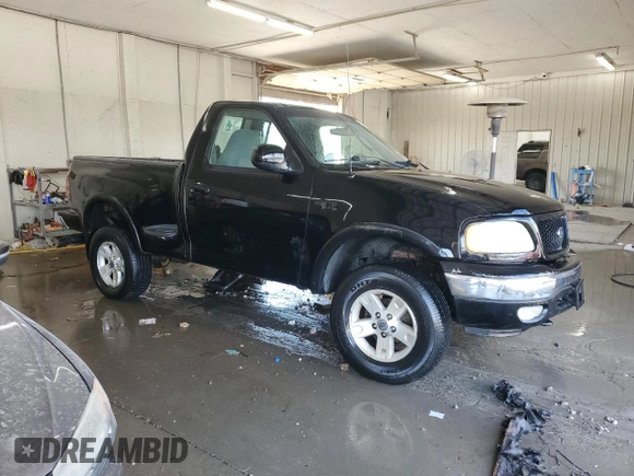 2003 Ford F-150 with VIN 2FTRF08L03CA03160, listed as a Copart auction lot 51591535 with 220,630 mi miles and Salvage title. Bid and sale history available at DreamBid. Image 4.