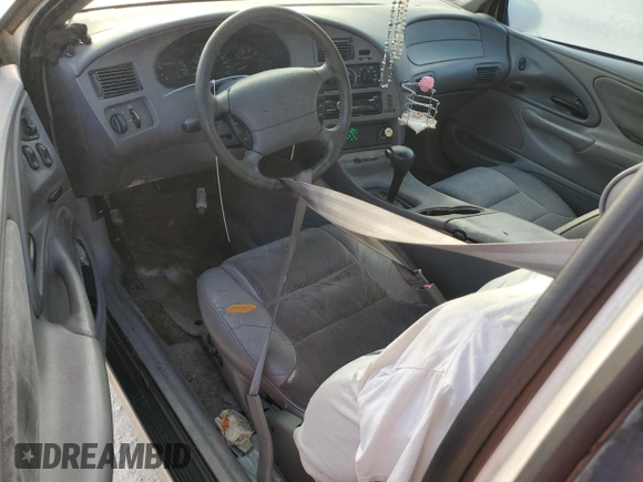 1997 Mercury Cougar z VIN 1MELM62W0VH602622, wystawiony jako Copart lot #77042354 z przebiegiem 122 027 mil mil oraz Nie do naprawy. Historia ofert i sprzedaży dostępna na DreamBid. Obrazek 8.