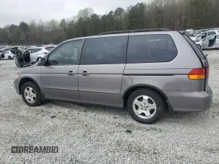2000 Honda Odyssey EX with VIN 2HKRL1865YH513885, listed as a Copart auction lot 50223505 with 214,627 mi miles and Salvage Title. Bid and sale history available at DreamBid. Image 2.