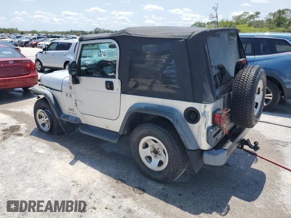 2004 Jeep Wrangler X with VIN 1J4FA39S74P763492, listed as a Copart auction lot 54664095 with 168,493 mi miles and Salvage Title. Bid and sale history available at DreamBid. Image 2.