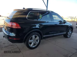 2011 Volkswagen Touareg с VIN WVGFG9BP2BD003056, выставлен на аукционе Copart как лот 84203674 с пробегом 171 456 миль миль и Списание • Salvage title. История ставок и продаж доступна на DreamBid. Изображение 3.