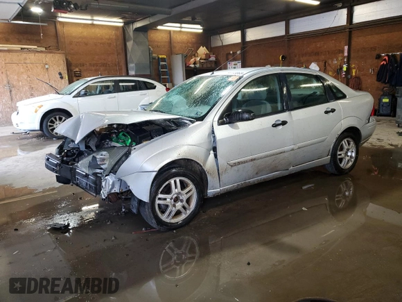 2003 Ford Focus SE z VIN 1FAFP34P43W186633, wystawiony jako Copart lot #56899065 z przebiegiem Nie podano mil oraz Szkoda całkowita • Salvage title. Historia ofert i sprzedaży dostępna na DreamBid. Obrazek 1.